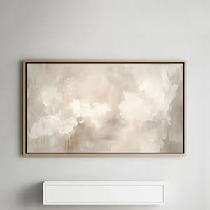 Beige and white abstract Samsung Frame TV Art showcased on a Samsung Frame TV above a modern floating shelf in a contemporary interior.