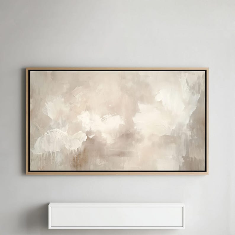Beige and white abstract Samsung Frame TV Art showcased on a Samsung Frame TV above a modern floating shelf in a contemporary interior.