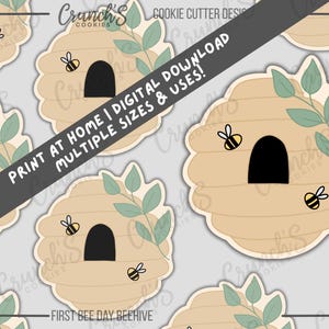 May include: Beehive cookie cutter design with a black arched entrance, surrounded by a light brown color. The design includes green leaves and small yellow and black bees. Text on the image says "Print at home | Digital download multiple sizes & uses!"