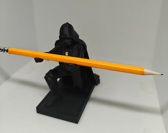 Darth Vader pencil holder from Star Wars bending to the dark side of the force pen