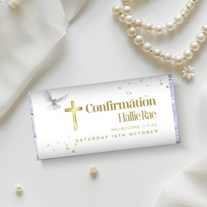 May include: White chocolate bar with gold foil wrapping. The bar features a white dove, a gold cross, and the text "Confirmation Hallie Rae, Melbourne 11.11.XX, Saturday 16th October".