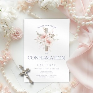May include: A white card with a floral cross design and the text "PLEASE JOIN US FOR THE CONFIRMATION OF HALLIE RAE SATURDAY 16TH OCTOBER THE STONY CHAPEL MELBOURNE VICTORIA LUNCH TO FOLLOW AT OUR HOUSE PLEASE RSVP BY 11/08/23"