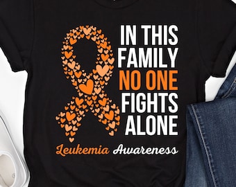 Camiseta de concientización sobre la leucemia. En esta familia nadie lucha solo. Camiseta de apoyo a los guerreros de la leucemia. Camisetas familiares a juego con lazo naranja. Regalo.
