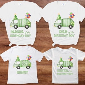 May include: Four white t-shirts with green garbage trucks and text. The shirts say "Mama of the Birthday Boy", "Dad of the Birthday Boy", "Henry" and "Sister of the Birthday Boy".