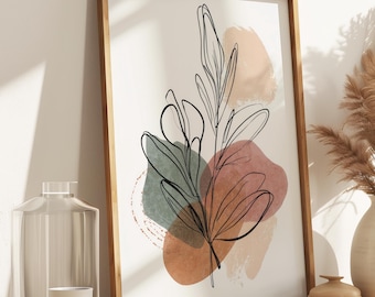 May include: A framed art print featuring a minimalist botanical illustration with black line art over abstract pastel shapes. The artwork is displayed on a wooden cabinet, alongside a vase with dried pampas grass and decorative items.