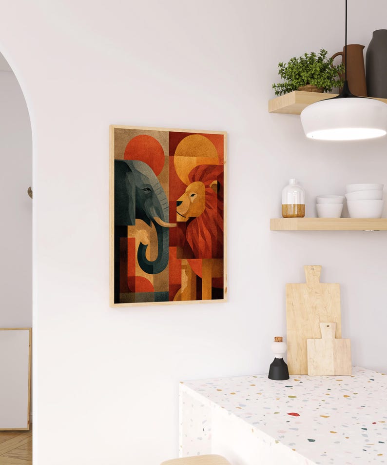 May include: A framed art print featuring a geometric design of an elephant and a lion facing each other. The artwork uses a palette of orange, red, and blue, with a wooden frame. The print is displayed on a white wall.