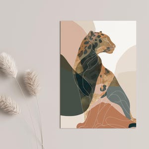 May include: An abstract art print featuring a leopard illustration. The artwork uses a palette of muted colors, including brown, green, and beige, with a white outline. The leopard is depicted in a seated position, with a focus on its profile. The background has abstract shapes.