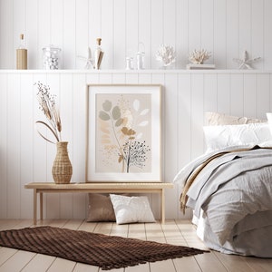 May include: A white bedroom with a wooden bench and a brown rug. A framed print with a floral design hangs on the wall above the bench. A bed with white and beige bedding is in the background.