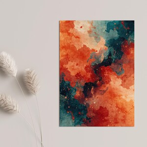 May include: Abstract art print featuring a watercolor design in shades of orange, red, and teal. The artwork has a textured appearance with a blend of colors, creating a dynamic and visually appealing composition. The print is rectangular and displayed on a neutral background.