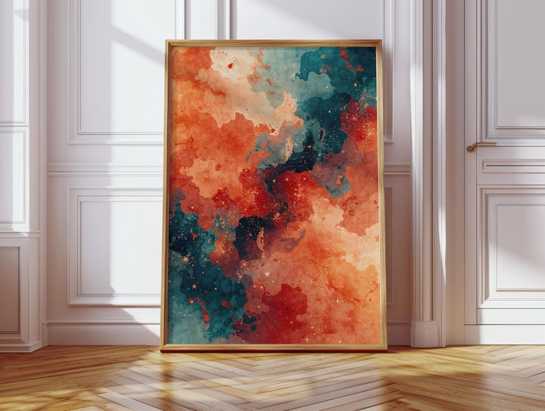 May include: A framed abstract art print featuring a watercolor design. The artwork showcases a blend of orange, teal, and red hues, with a speckled, cloudy effect. The frame is a light brown color, and the print is displayed on a wooden floor.
