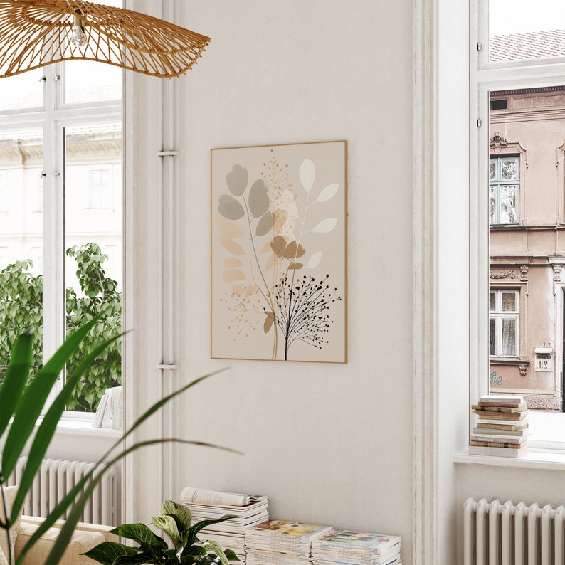 May include: A beige and brown abstract floral print wall art with a light brown frame. The print features stylized leaves and flowers in shades of beige, brown, and green.
