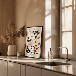 May include: A framed botanical print with a white background and colorful flowers. The print is titled "Flower Market" and has the text "Botanical Collection" at the bottom.