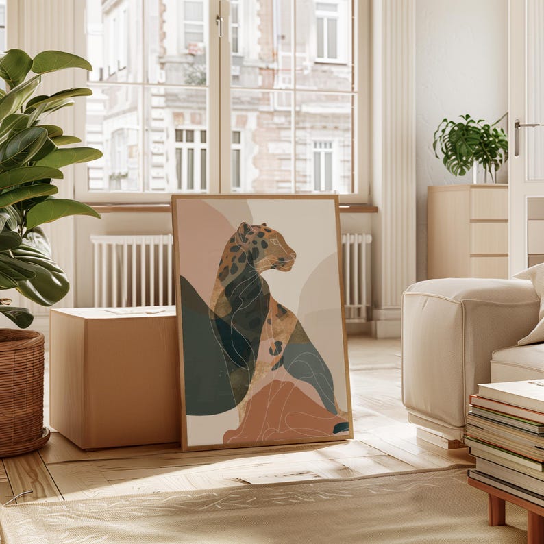 May include: A framed art print featuring an abstract illustration of a leopard. The artwork uses a palette of muted colors, including beige, brown, and teal, with a minimalist design. The leopard is depicted in profile, with a focus on its spotted coat.