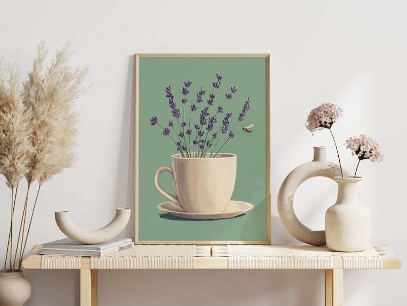 May include: A framed illustration of a white teacup and saucer with a bouquet of purple lavender flowers inside. A small bee flies above the flowers against a green background.