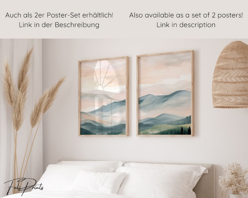May include: Two framed watercolor landscape prints with a mountain range and a sunrise in the background. The prints are hanging on a white wall above a bed with white bedding. The text "Also available as a set of 2 posters! Link in description" is at the top of the image.