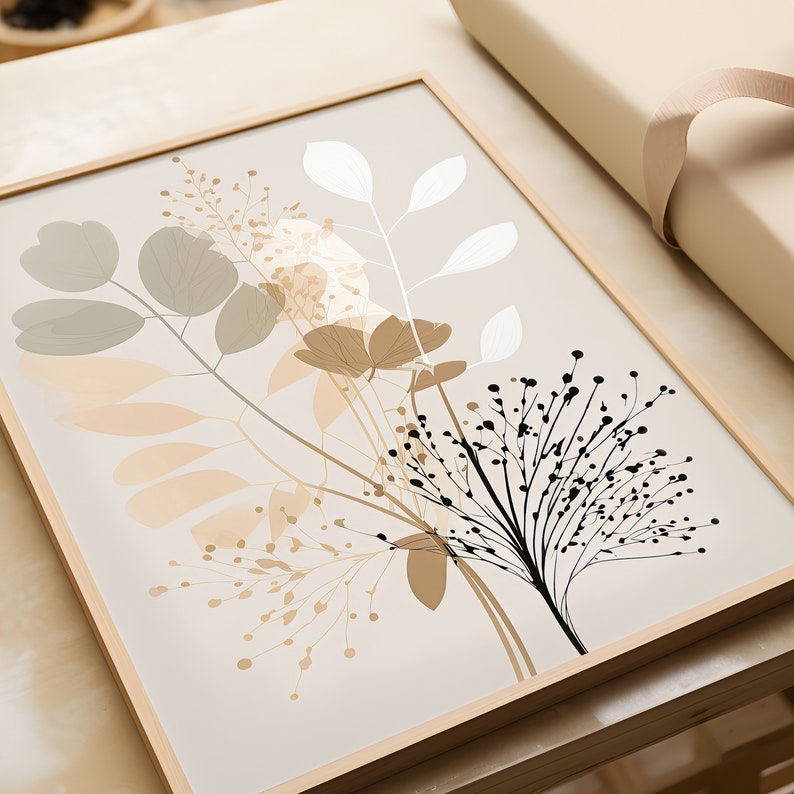 May include: A framed print with a botanical illustration of stylized leaves and flowers in shades of beige, brown, and black on a light beige background.