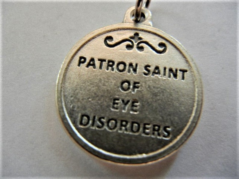 St. Lucy Patron Saint of Eye Disorders Round Medal 3/4 Tall Silver Tone