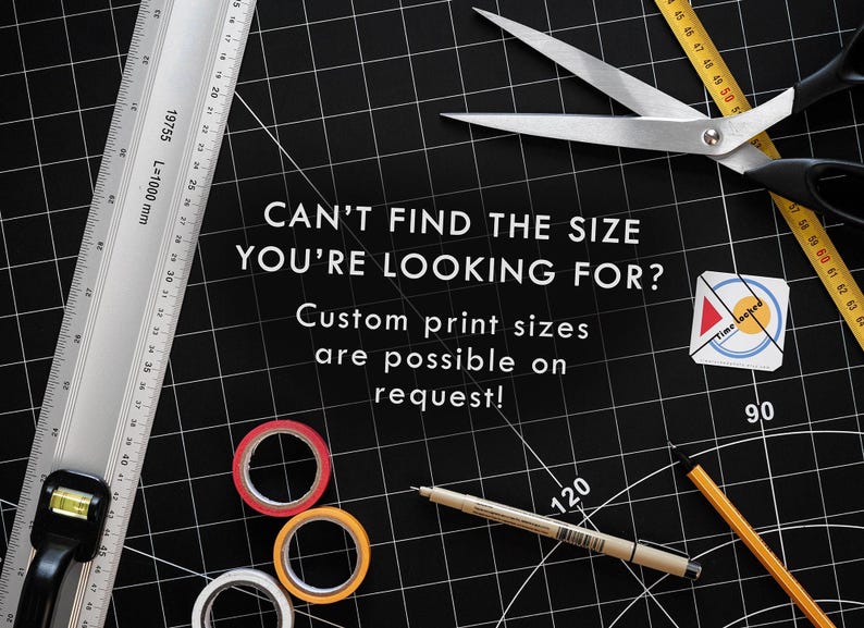 May include: A black cutting mat with a ruler, scissors, tape, and a pencil. The text "CAN'T FIND THE SIZE YOU'RE LOOKING FOR? Custom print sizes are possible on request!" is written on the mat.
