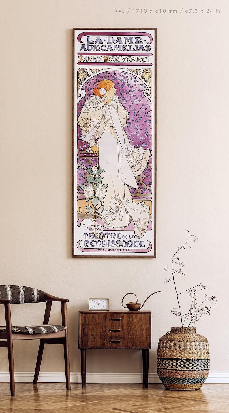 May include: A vintage poster for a play called "La Dame Aux Camelias" starring Sarah Bernhardt. The poster features a woman in a white dress with a flower in her hand, standing in front of a purple background with stars. The text "Theatre de la Renaissance" is at the bottom of the poster.