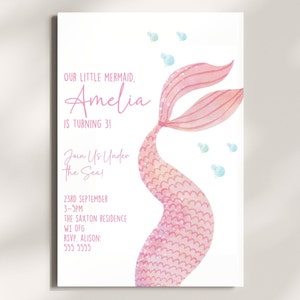 May include: A pink mermaid tail with glitter and a watercolor effect. The text "Our little mermaid, Amelia is turning 3!" is at the top of the invitation. The text "Join us under the sea!" is below the mermaid tail. The invitation also includes the date, time, location, and RSVP information.