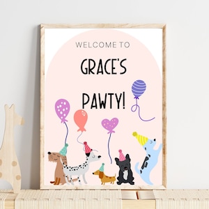 May include: A pink and white welcome sign with the text "Welcome to Grace's Pawty!" surrounded by colorful balloons and dogs wearing party hats.