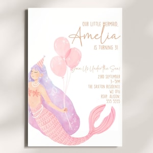 May include: A pink and purple mermaid illustration with a party hat and holding pink balloons. The text reads "Our little mermaid, Amelia is turning 3! Join us under the sea! 23rd September 3-5pm The Saxton Residence W1 OFG RSVP. Alison: 555 5555"