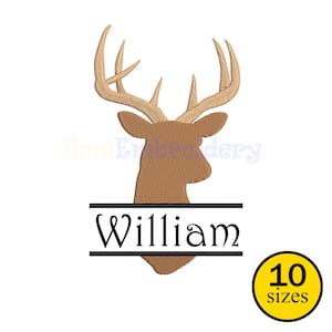 Puede incluir: Diseño bordado de una cabeza de ciervo marrón con cuernos. El nombre "William" se muestra en fuente negra, centrado debajo de la cabeza del ciervo. Un círculo amarillo con el texto "10 tamaños" está en la esquina inferior derecha.