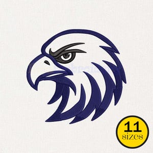 May include: A stylized eagle head embroidery design in navy blue and black. The eagle's eye is black, with a white background. A yellow circle with the text "11 sizes" is in the lower right corner.
