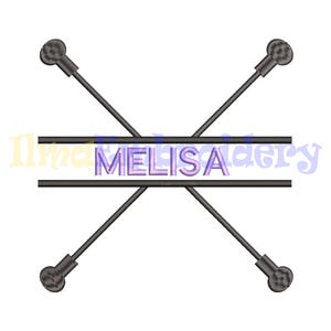 May include: Embroidered design featuring two crossed sticks with rounded ends and a double line banner with the name "MELISA" in purple lettering.