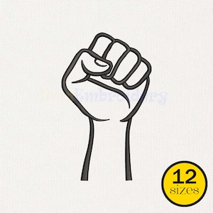 May include: A black embroidered outline of a raised fist in a clenched position. In the bottom right corner, there is a yellow circle containing the black text 12 sizes. The design is set against a white fabric background with a visible texture.