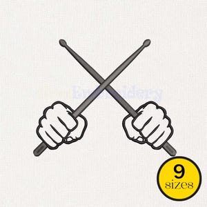 May include: An embroidered design featuring crossed drumsticks held by two fists. The design is in black and white, with a yellow circle at the bottom right that says "9 sizes".