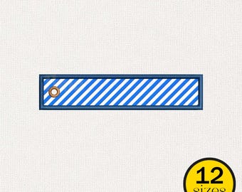 May include: A rectangular blue and white striped design with a dark blue border and a gold grommet. The design is on a white background. A yellow circle with the number 12 and the word "sizes" is in the lower right corner.
