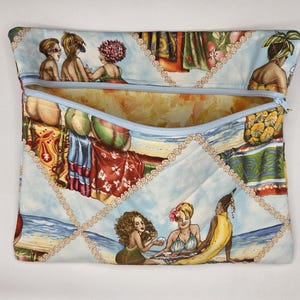 May include: A quilted fabric pouch featuring a light blue zipper and a repeating beach scene print. The pattern displays various figures in swimwear, tropical foliage, and ocean waves, all interconnected by a decorative beige chain-link motif.