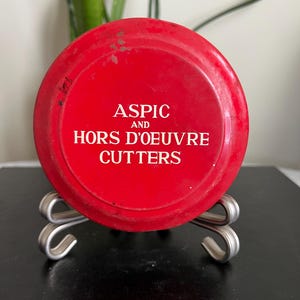 Vintage circa the 1950s Aspic and Hors D’oeuvre Cutters in Original Tin- 12 piece set of Aspic Hors D’Oeuvre cutters