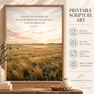 May include: A framed wall art print featuring a golden prairie landscape at sunset with bison in the distance. The text reads: Fear not, for I am with you; be not dismayed, for I am your God. I will strengthen you. Isaiah 41:10. Includes digital download icons.