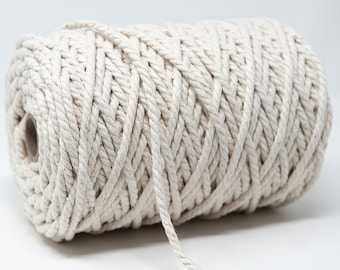 May include: A roll of natural white cotton rope, ideal for crafting, macrame, or home decor projects.