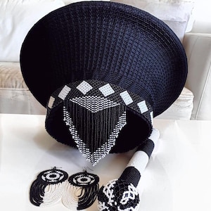 3 piece Zulu set. A hat with matching Zulu stick and earrings