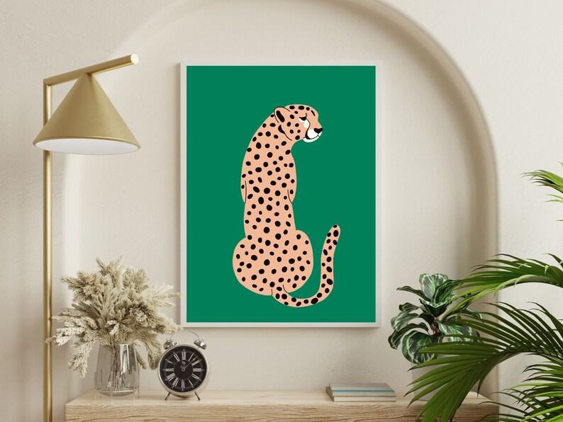 May include: A digital illustration of a cheetah sitting on a green background. The cheetah is pink with black spots.