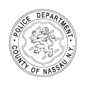 May include: Black and white illustration of a seal with the text "Police Department County of Nassau N.Y."