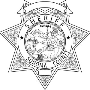May include: Black and white illustration of a sheriff's badge with a star shape and the words "Sheriff Sonoma County" around the perimeter. The center of the badge features a seal with the words "Eureka" and a woman holding a spear standing on a bear.