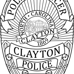May include: Black and white illustration of a police badge with the text "Police Officer" at the top, "North Carolina Clayton 1869" in the center, and "Clayton Police N.C." at the bottom.