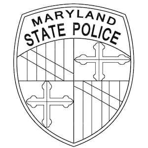 May include: Black and white Maryland State Police badge. The shield-shaped emblem features the words "MARYLAND STATE POLICE" at the top. The design includes a cross and a segmented pattern, with a detailed outline.