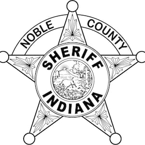May include: Black and white illustration of a sheriff's star badge with the words "Noble County Sheriff Indiana" in a circle in the center.