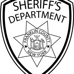 May include: Black and white illustration of a sheriff's badge with a star and the text "SHERIFF'S DEPARTMENT FRANKLIN COUNTY NEW YORK".