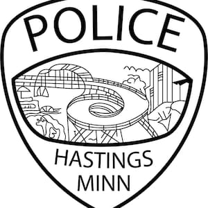 May include: Black and white line drawing of a police badge with the word "POLICE" at the top, a stylized image of a bridge in the center, and the words "HASTINGS MINN" at the bottom.