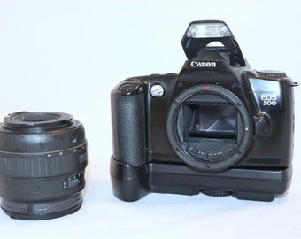 Canon EOS 500 SLR camera with Sigma zoom lens 3.5-4.5/28-70 mm and Canon hand grip with battery pack, tested