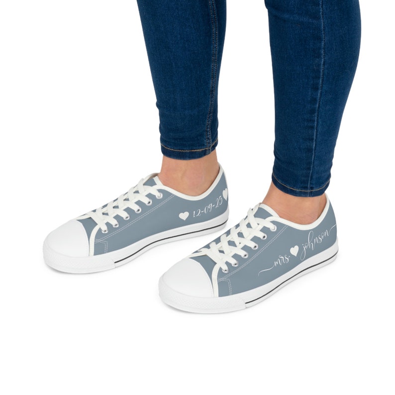 Dusty blue womens low top sneakers in a Converse style with white laces, soles, and custom text. Can be personalized with your name or text of your choice. These are ideal as bridal sneakers to match your wedding color, or your school colors.