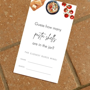 May include: A white card with the text "Guess how many pasta shells are in the jar?" and illustrations of pasta, cheese, and tomatoes. The card includes spaces for a name and guess.
