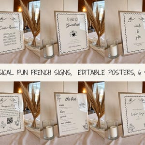 May include: Six framed signs with black text on white backgrounds. The signs include text such as "Cookie Flavors", "Photo Guestbook", "Cards & Gifts", "Honeymoon Fund", "The Bar", and "Custom Syrup". The signs are decorated with decorative borders and bows.