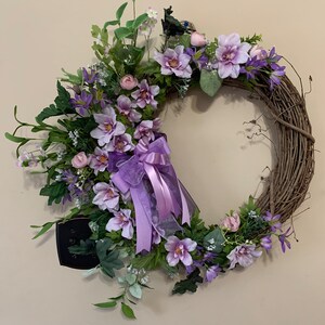 A Beautiful Purple Clematis Flower Wreath 18 inches with Bow